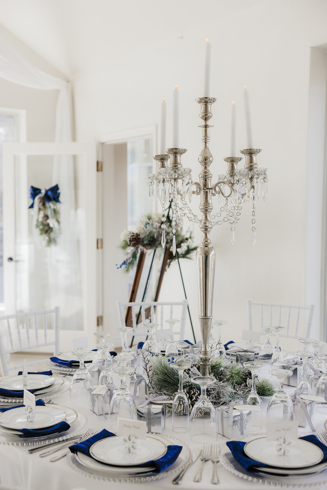 A winter-themed wedding table centerpiece at glass chapel