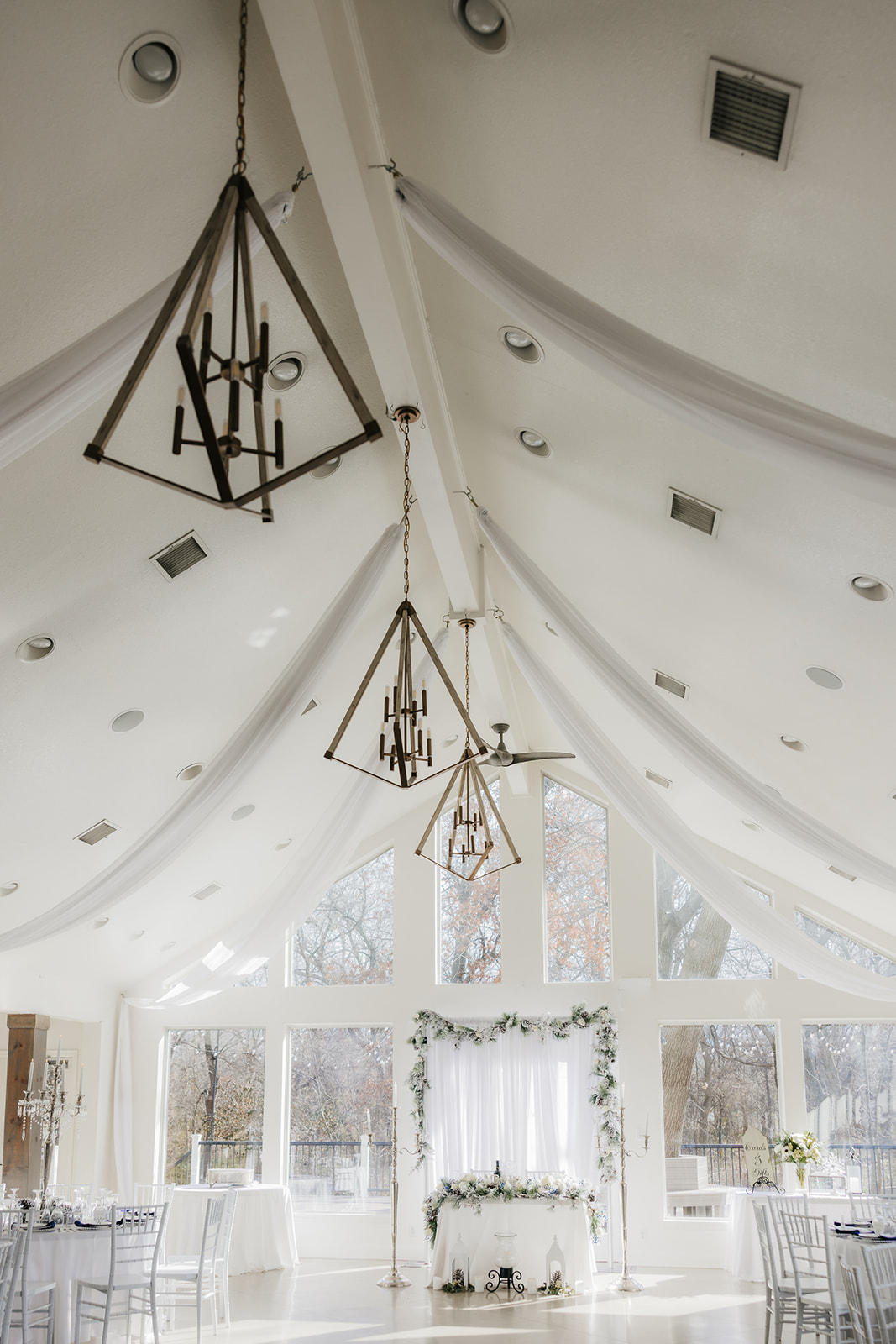 A winter-themed wedding table centerpiece at glass chapel