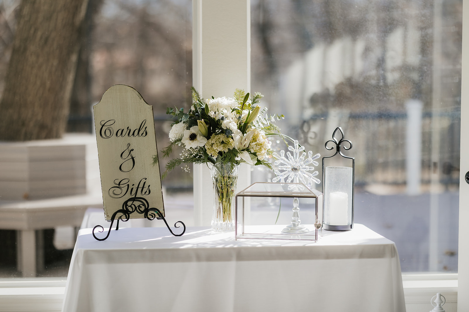 A winter-themed wedding table centerpiece at glass chapel