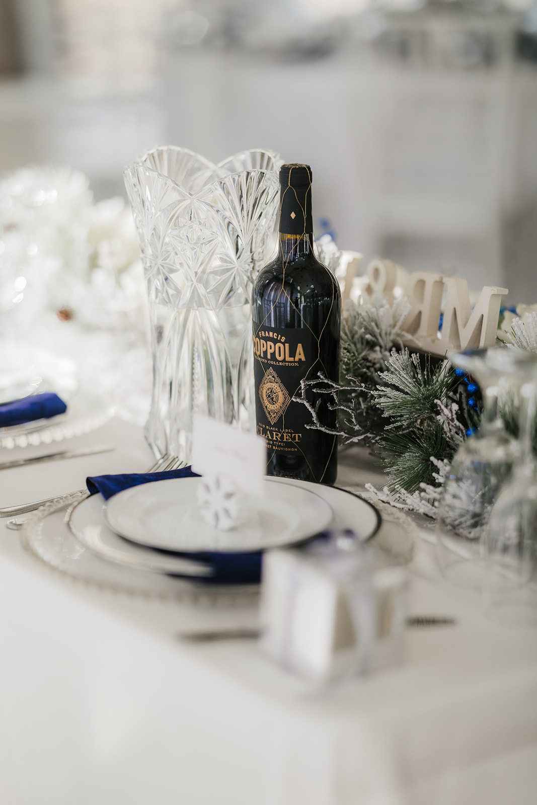 A winter-themed wedding table centerpiece at glass chapel