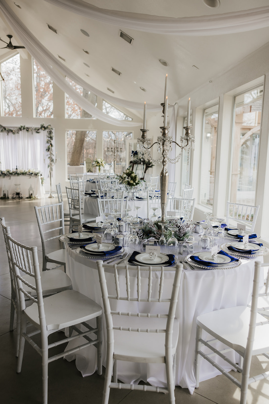 A winter-themed wedding table centerpiece at glass chapel