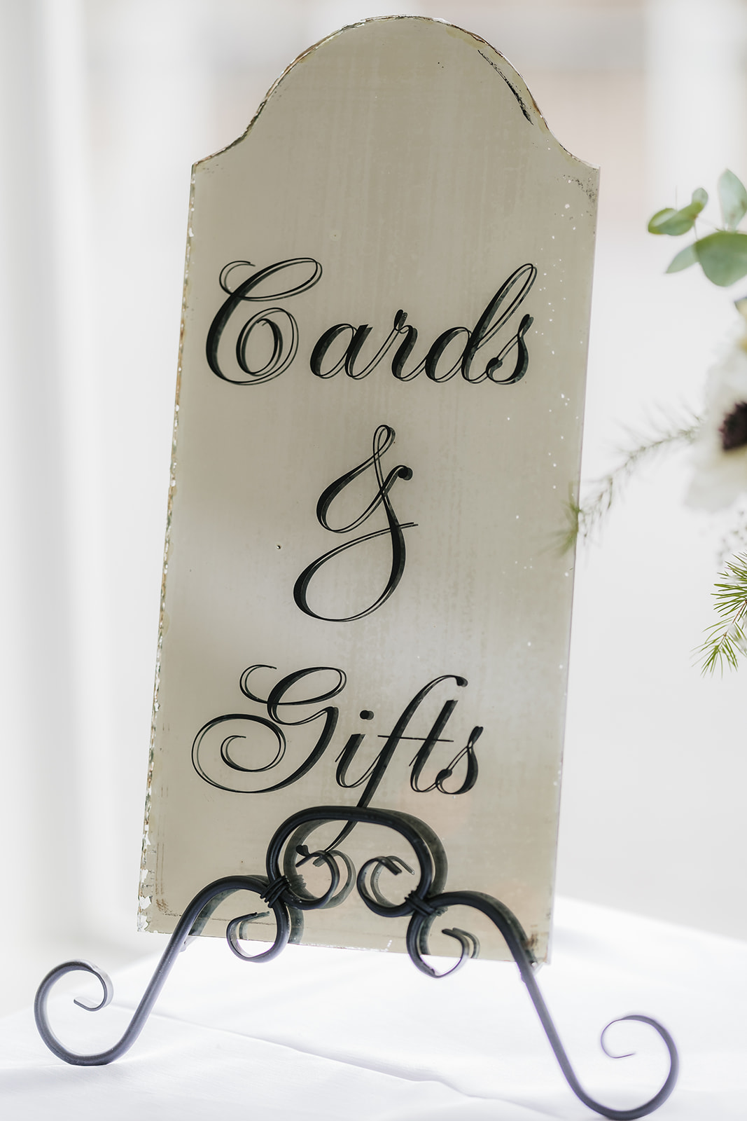 A winter-themed wedding table centerpiece at glass chapel