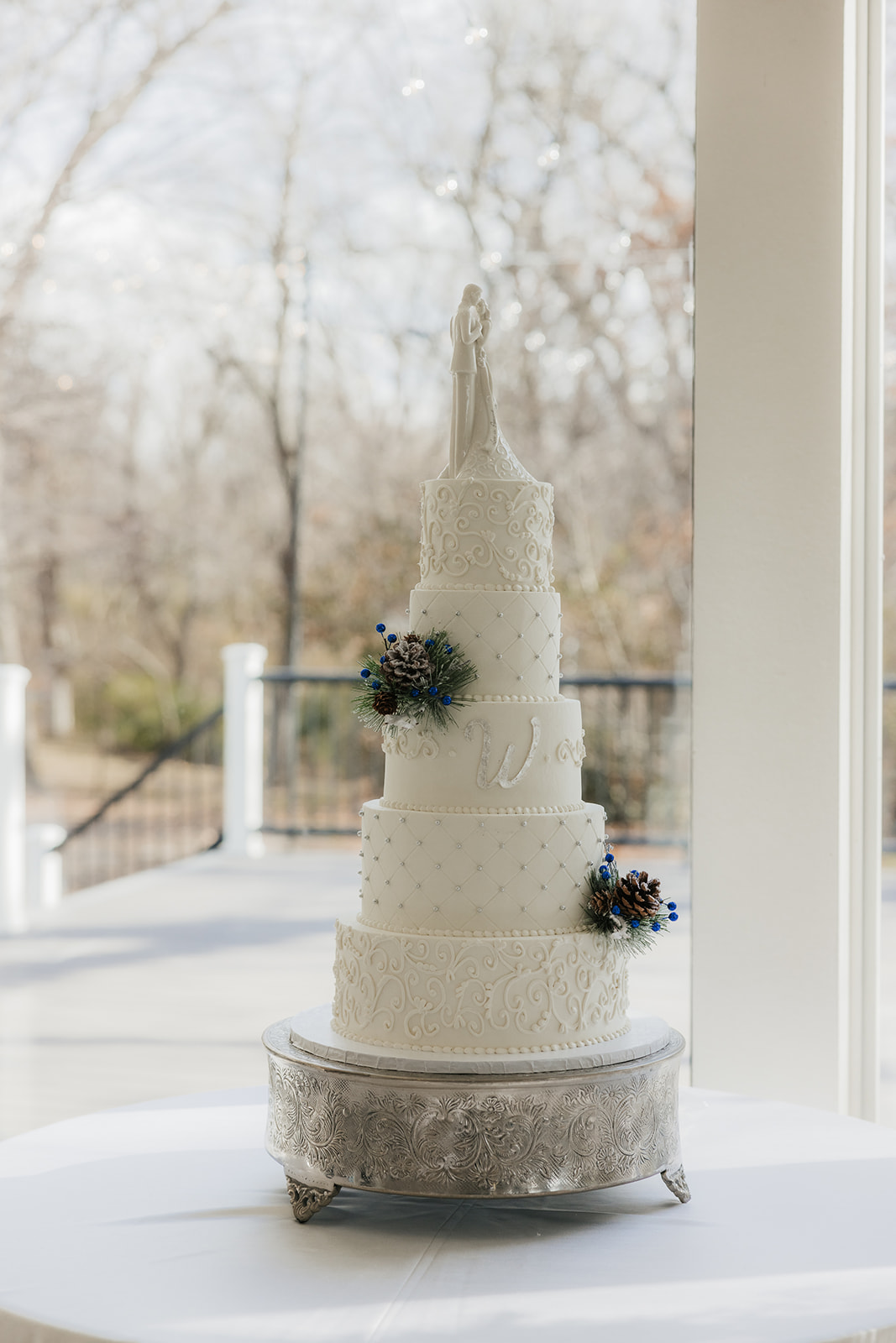 A winter-themed wedding table centerpiece at glass chapel