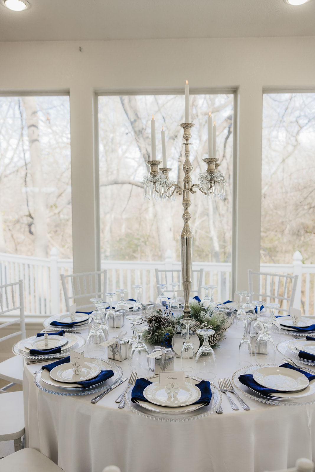 A winter-themed wedding table centerpiece at glass chapel