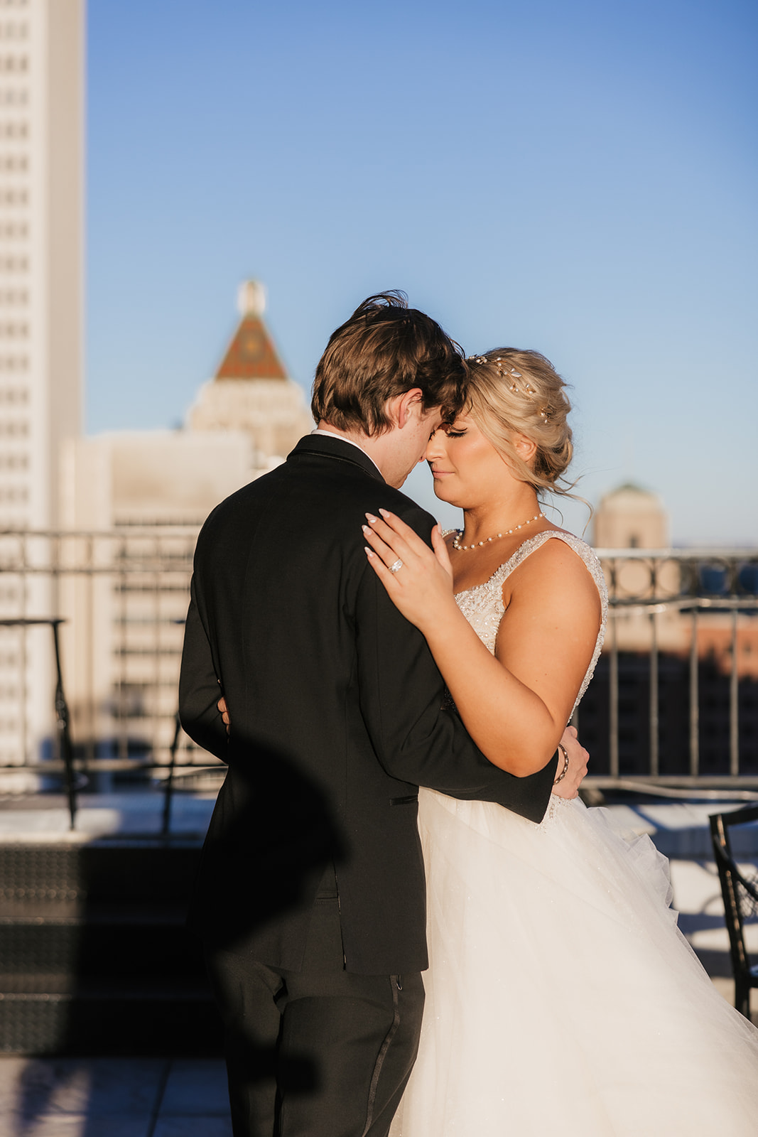 bride and groom take wedding portraits for their wedding at the Mayo Hotel