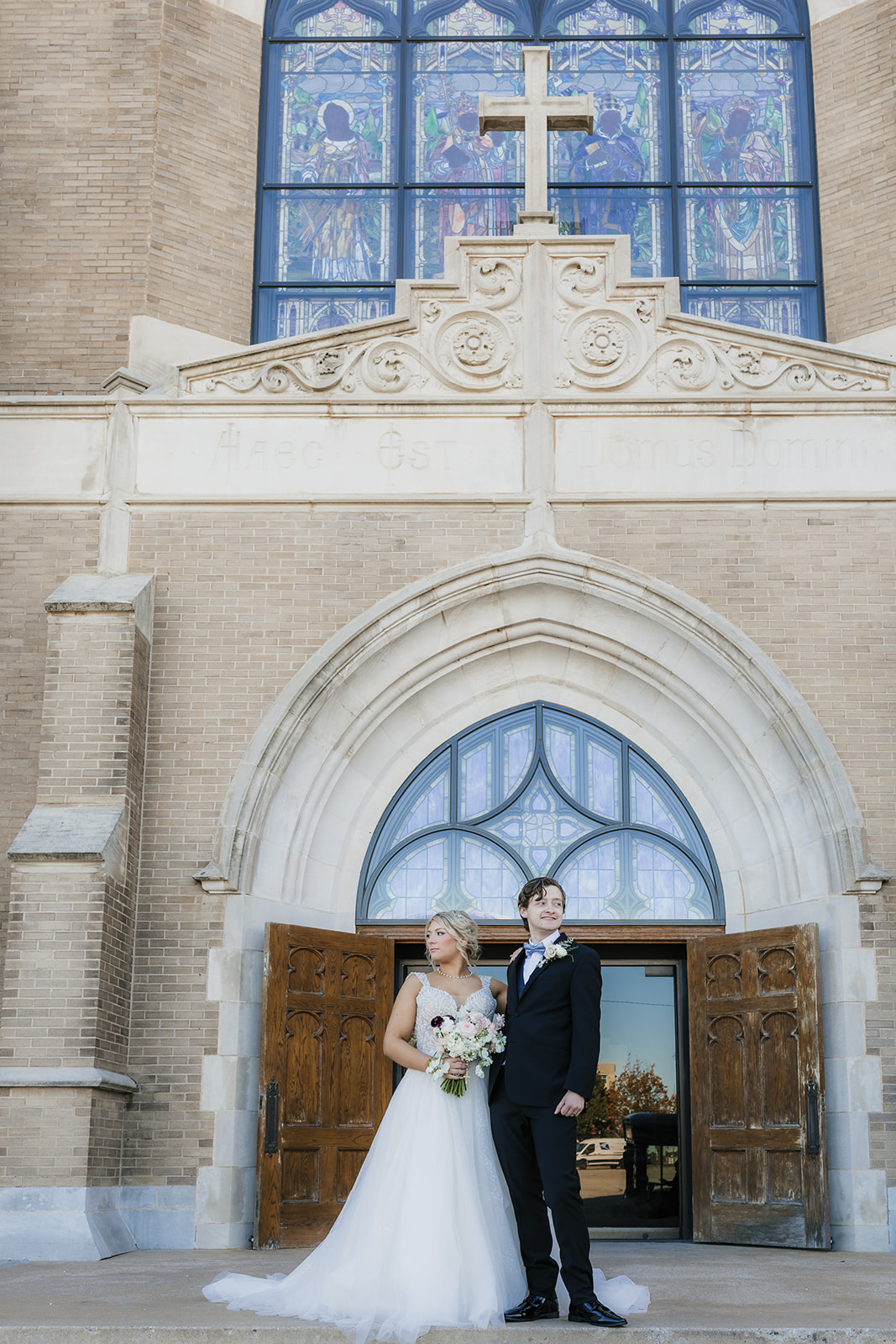 bride and groom take wedding portraits for their wedding at the Mayo Hotel