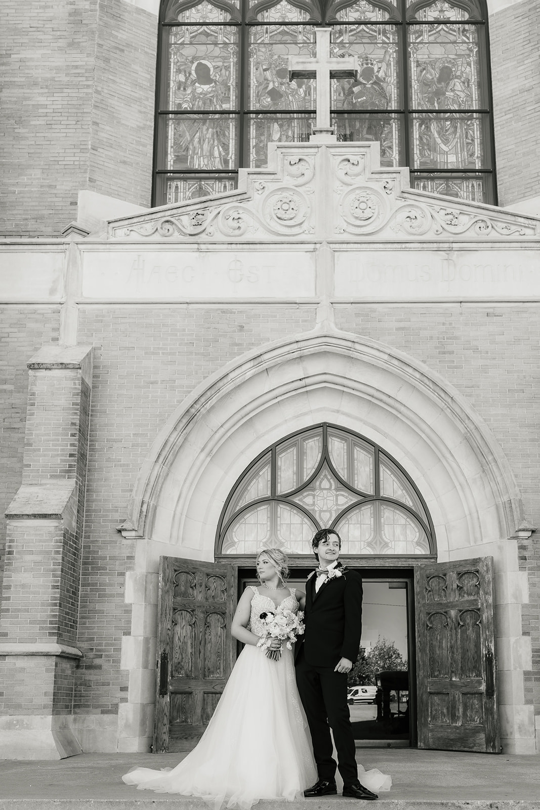 bride and groom take wedding portraits for their wedding at the Mayo Hotel