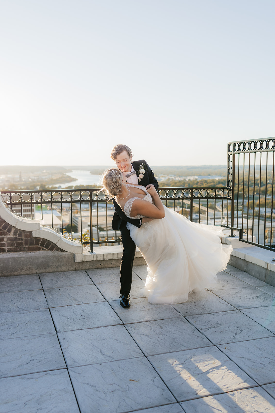 bride and groom take wedding portraits for their wedding at the Mayo Hotel