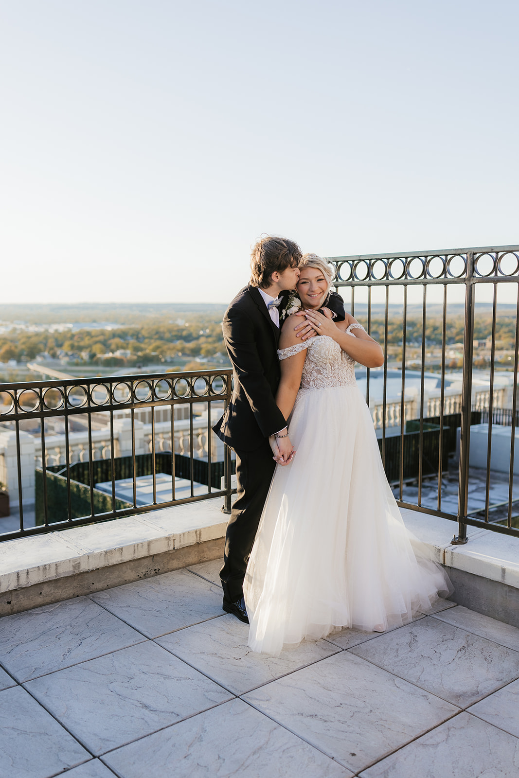 bride and groom take wedding portraits for their wedding at the Mayo Hotel