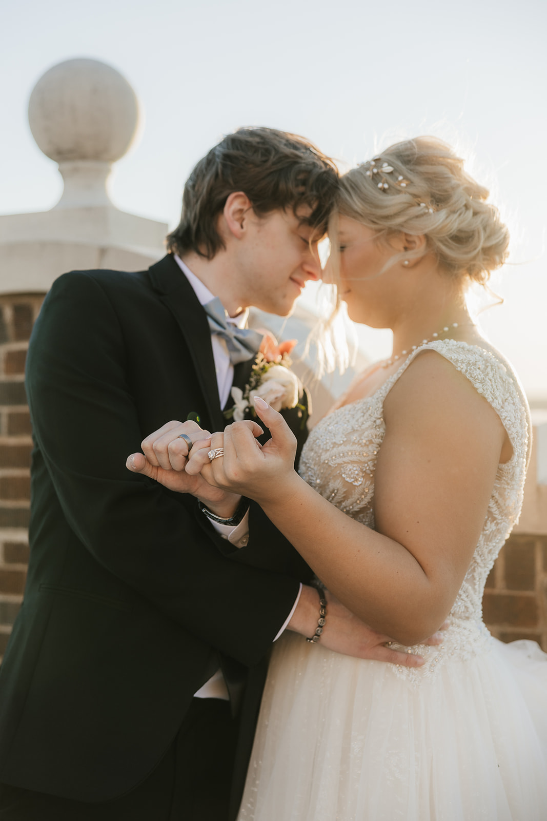 bride and groom take wedding portraits for their wedding at the Mayo Hotel