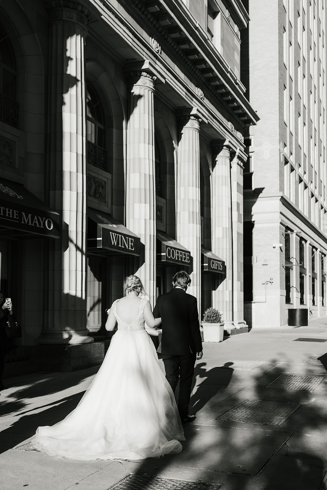 bride and groom take wedding portraits for their wedding at the Mayo Hotel