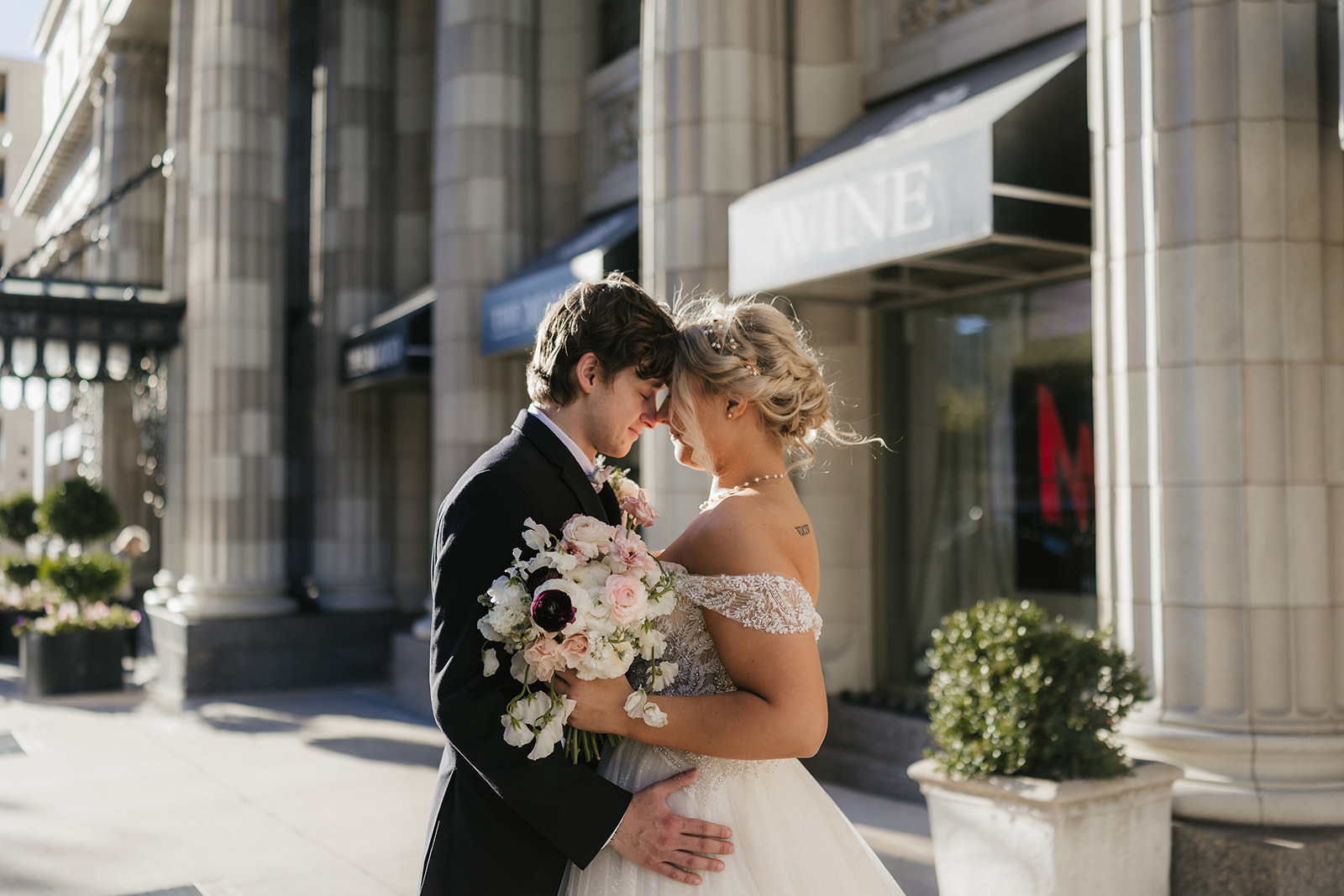 bride and groom take wedding portraits for their wedding at the Mayo Hotel