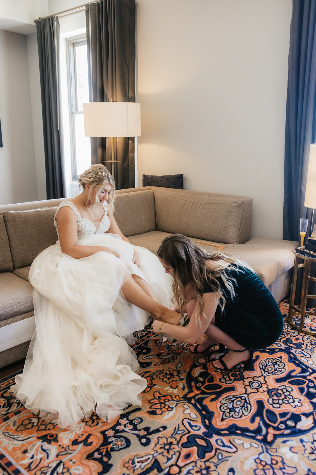 Bride getting ready with her bridesmaids for her wedding at the Mayo hotel