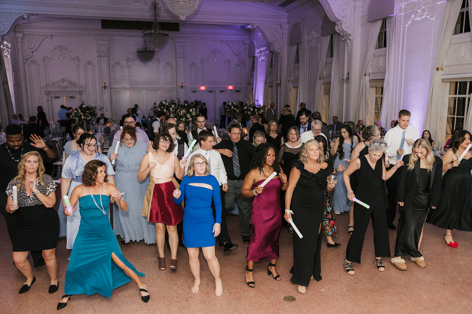 People dancing on the dance floor and having fun for a wedding reception at the mayo hotel 