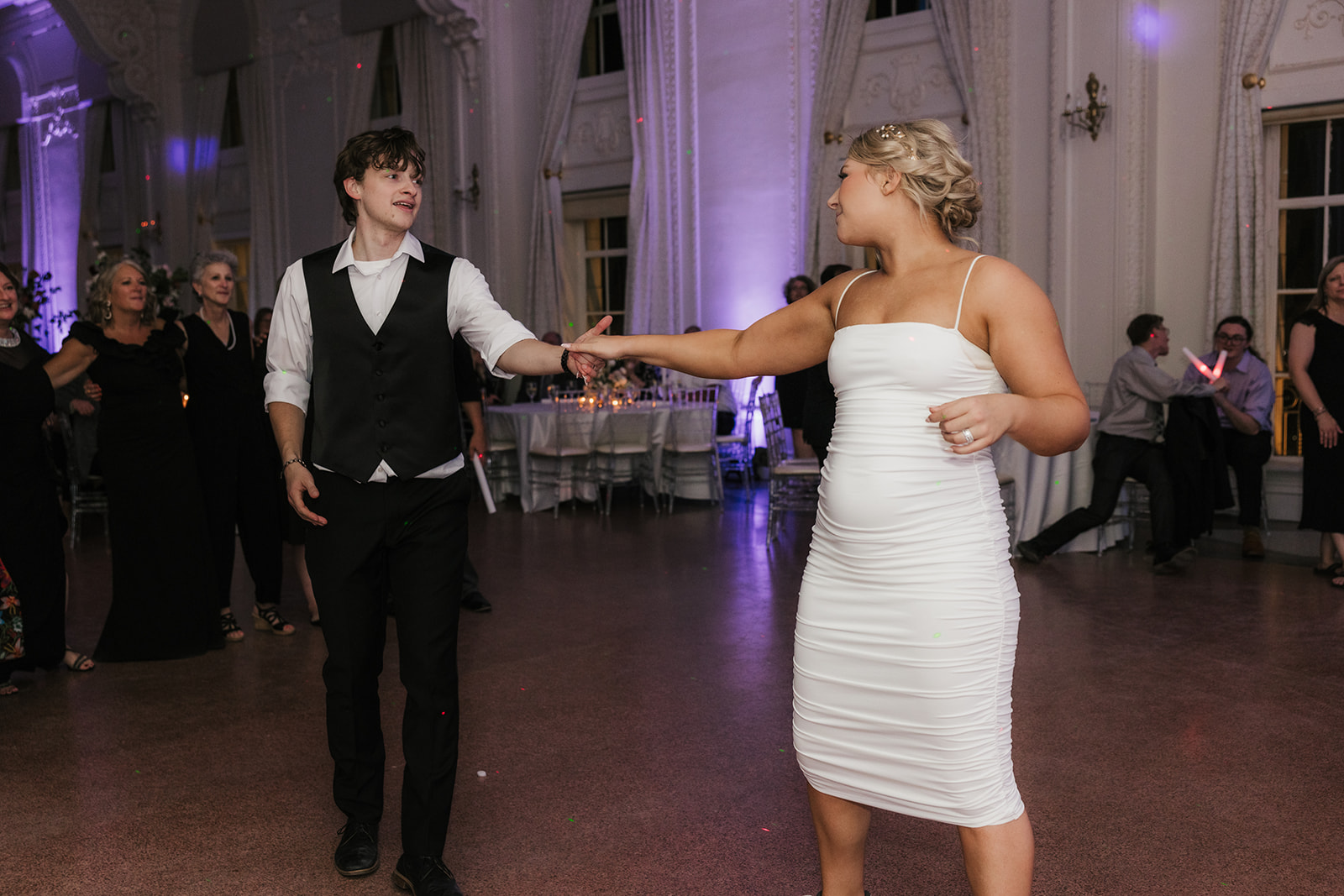 People dancing on the dance floor and having fun for a wedding reception at the mayo hotel