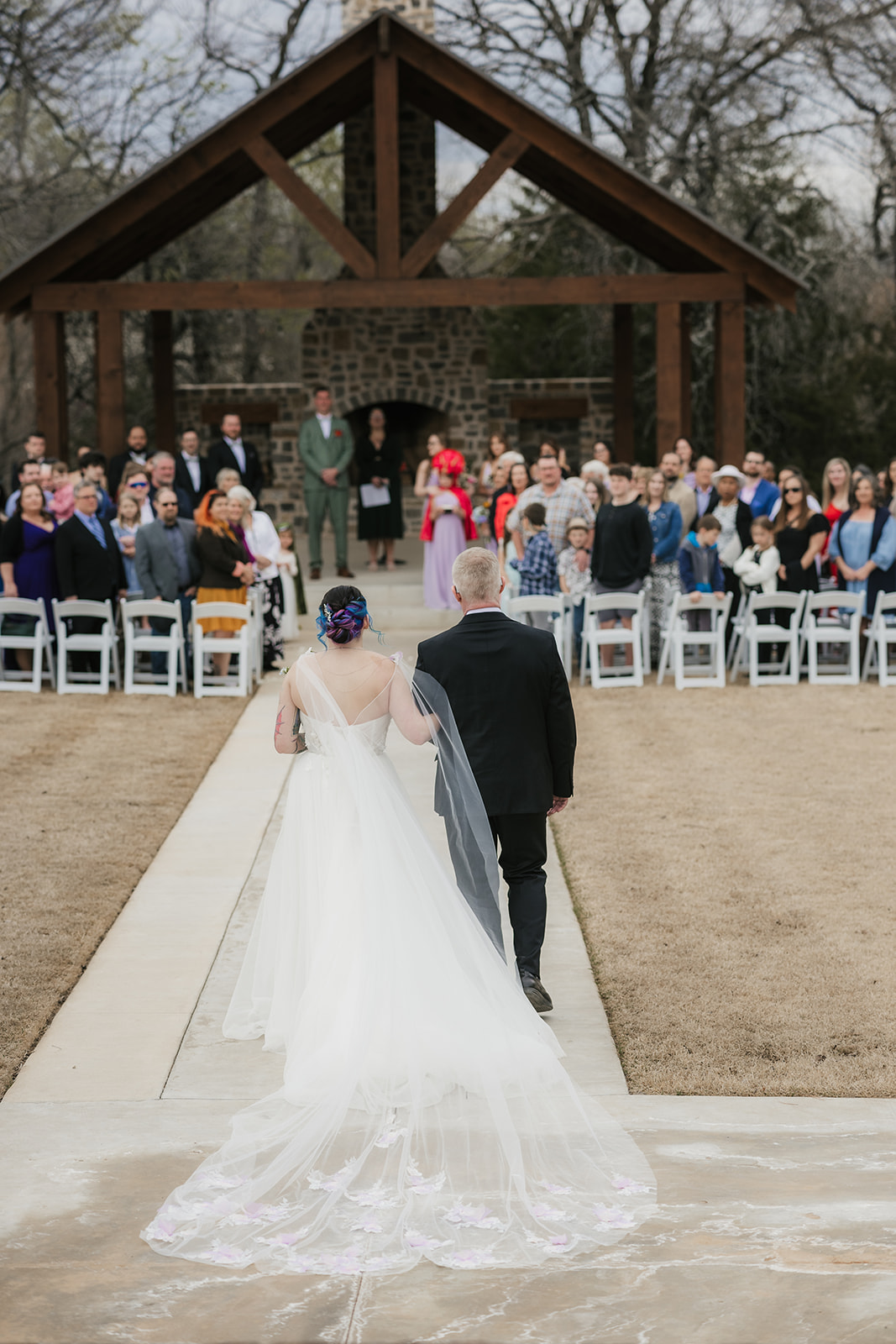 couple has a wedding ceremony outdoors at Discoveryland Ranch