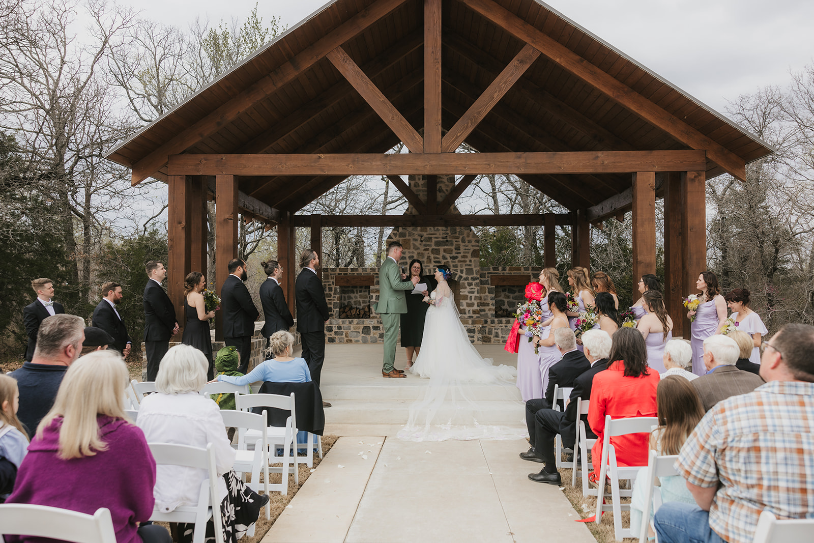 couple has a wedding ceremony outdoors at Discoveryland Ranch