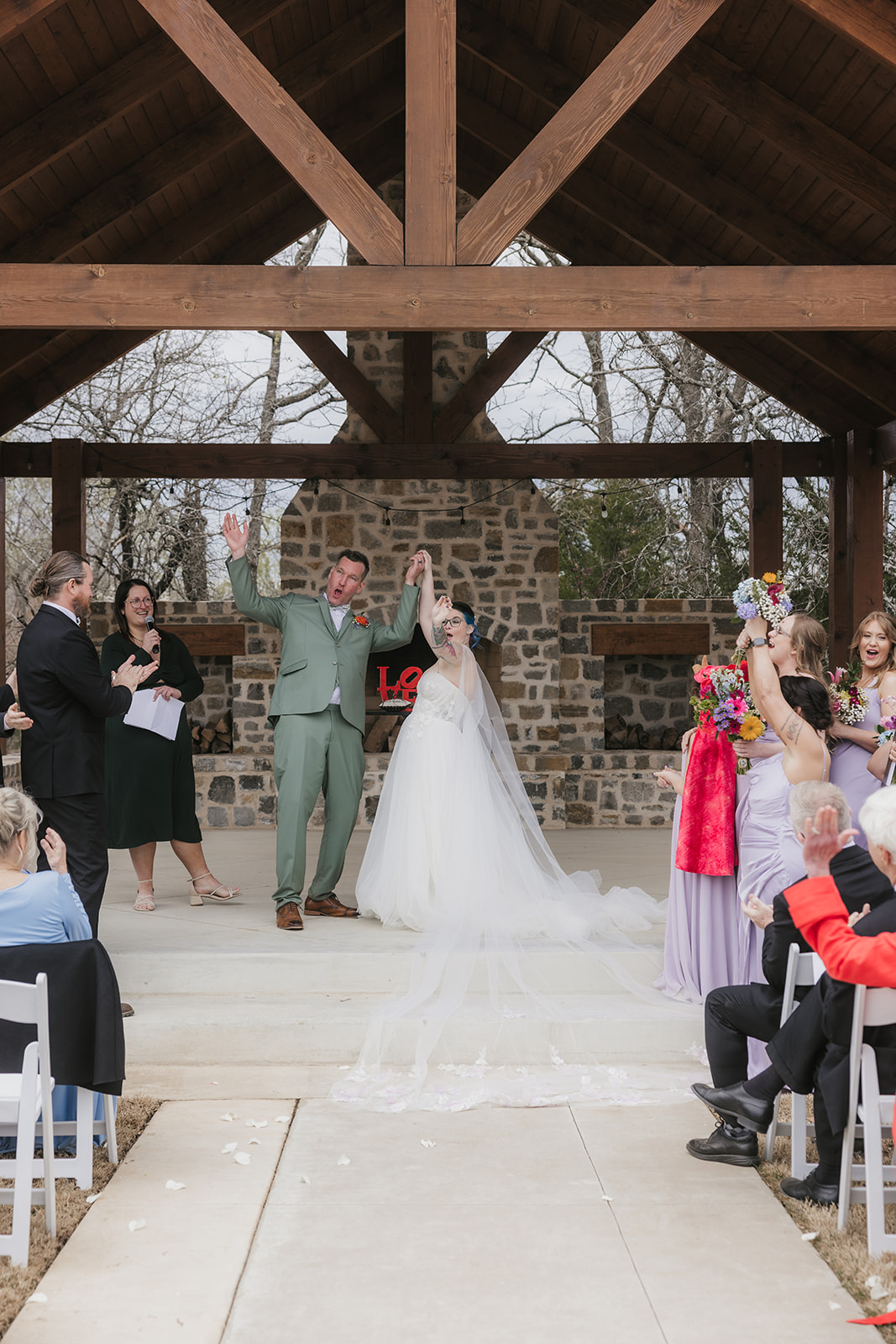couple has a wedding ceremony outdoors at Discoveryland Ranch