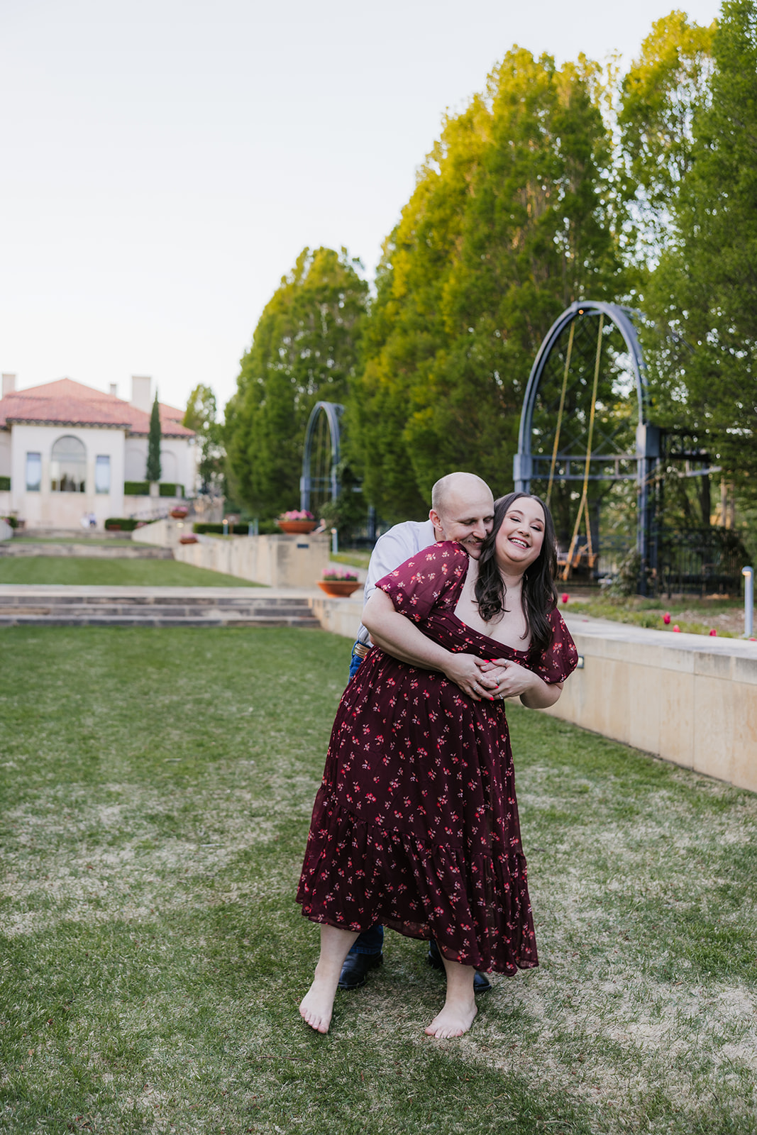 couple takes engagement photos at the Philbrook Museum of Art