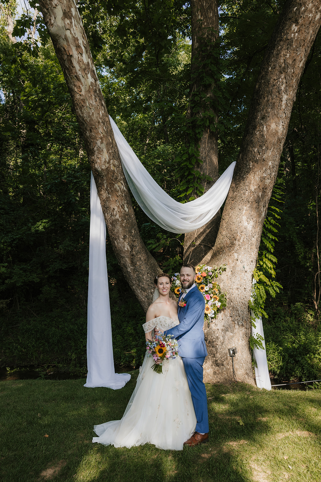 bride and groom take wedding portraits at Spain ranch