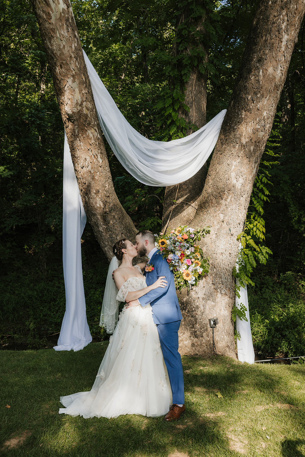 bride and groom take wedding portraits at Spain ranch