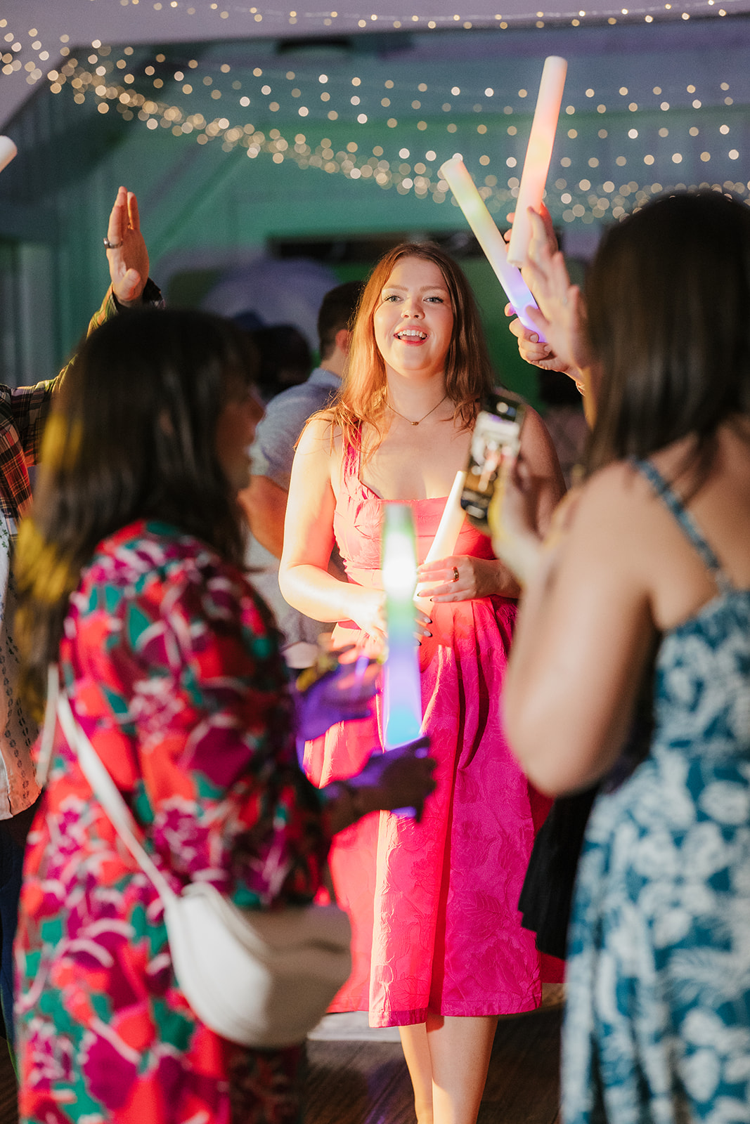people dancing on the dance floor for a fun wedding at spain ranch