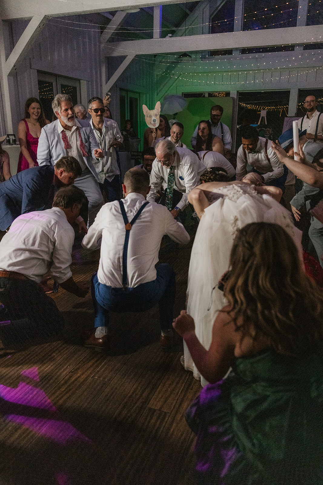 people dancing on the dance floor for a fun wedding at spain ranch