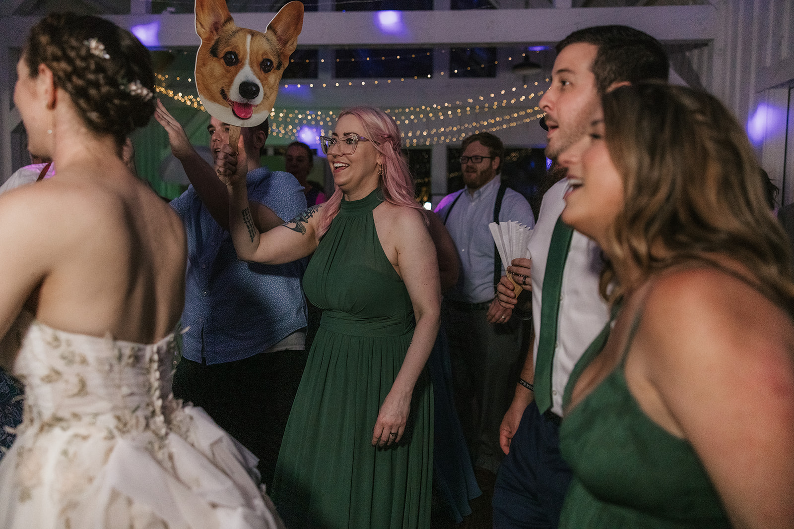 people dancing on the dance floor for a fun wedding at spain ranch