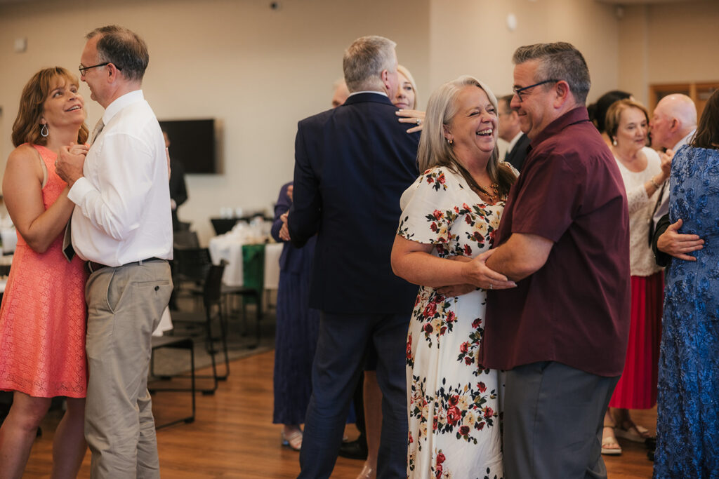 people dancing on the dance floor at a celebration