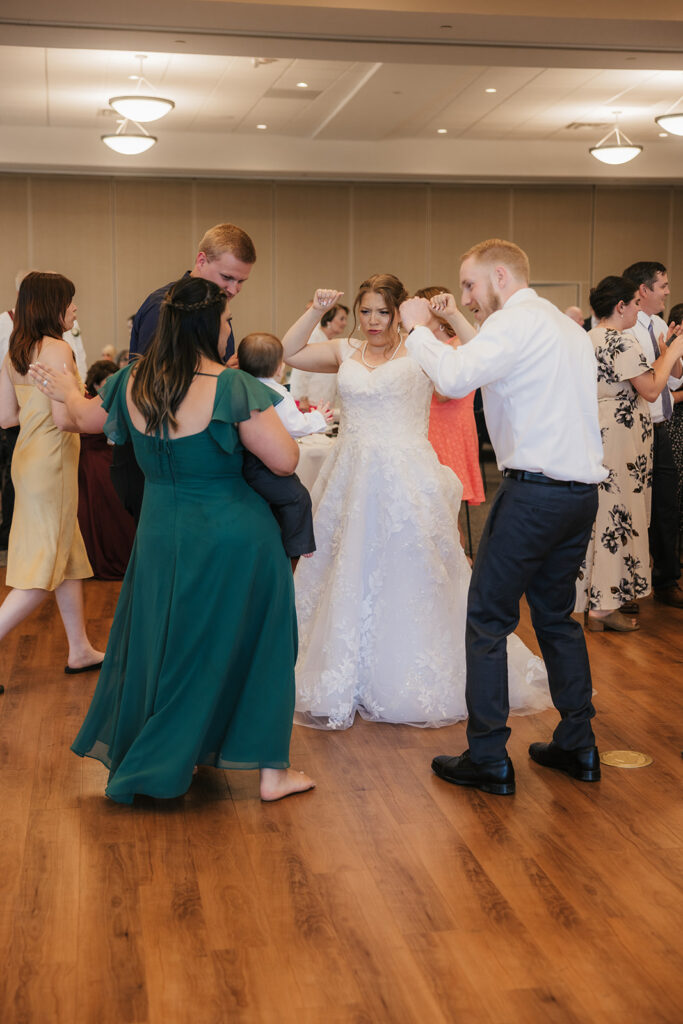 people dancing on the dance floor at a celebration