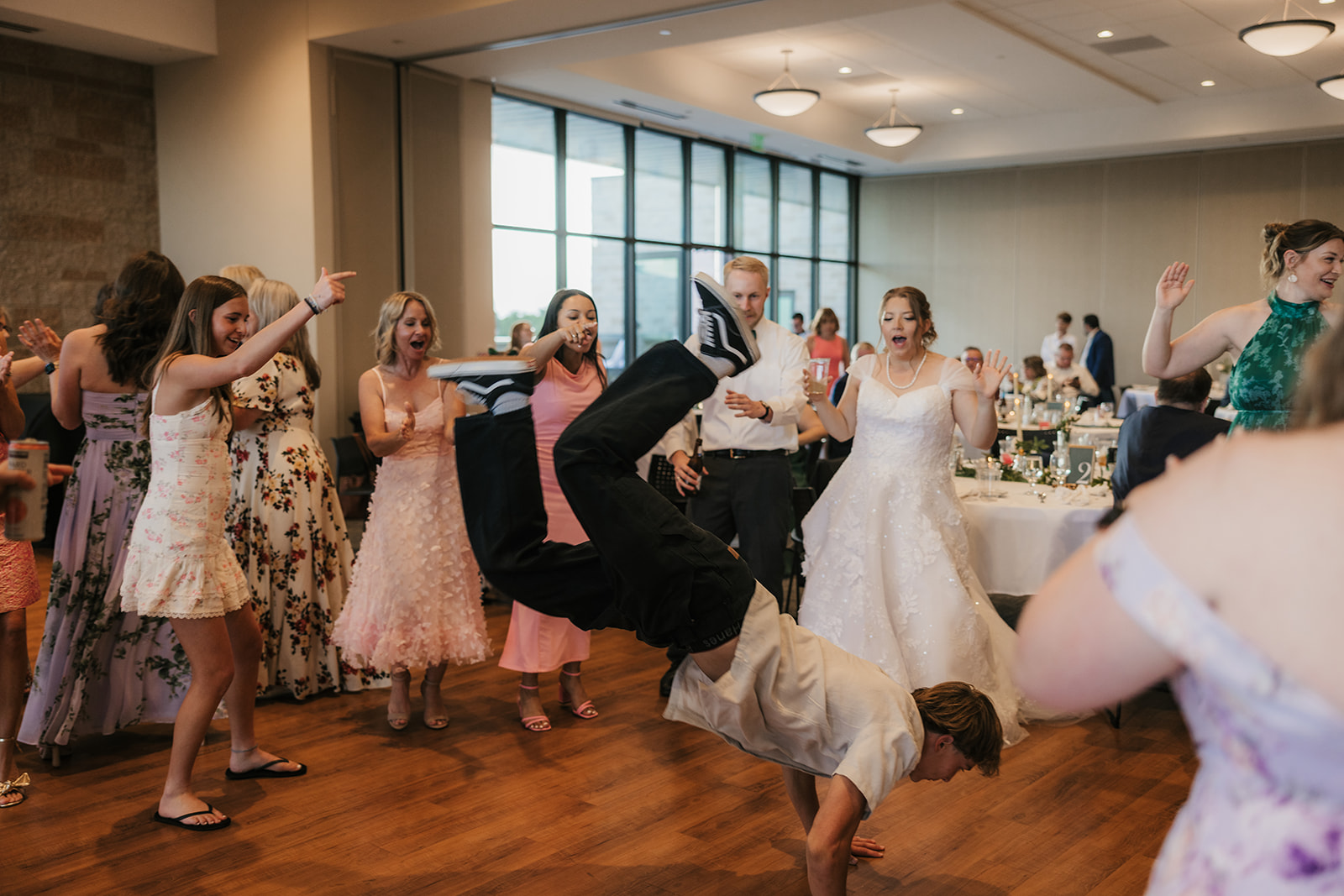 people dancing on the dance floor at a celebration