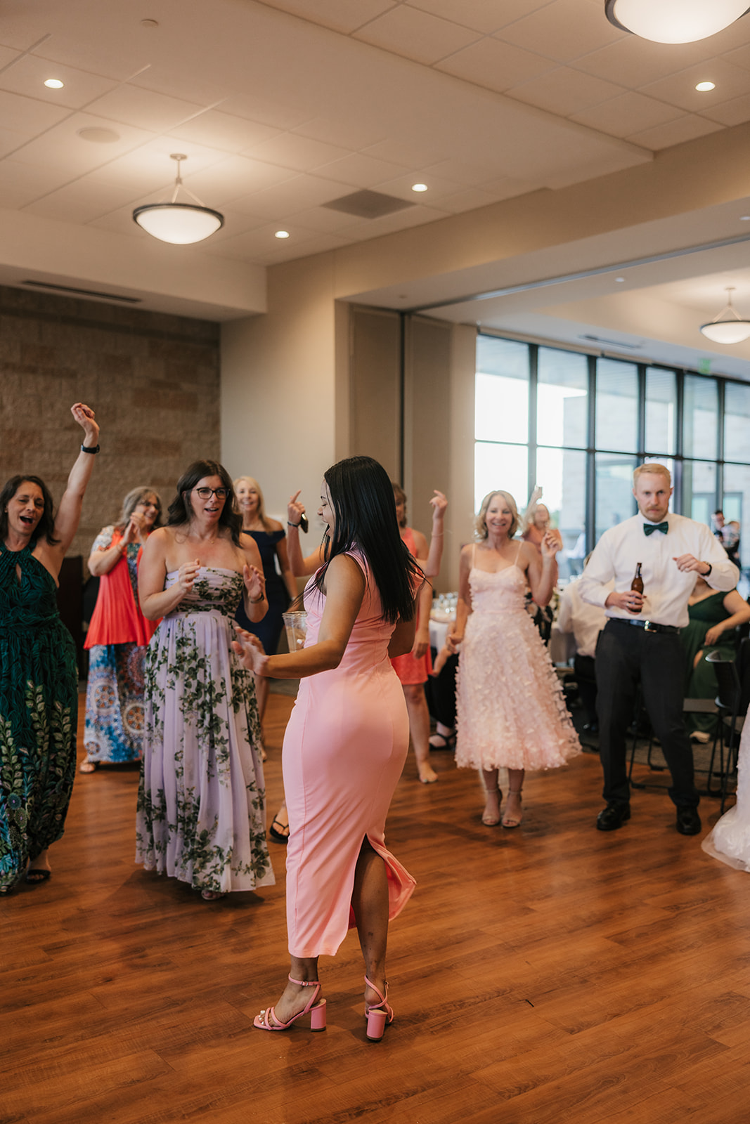 people dancing on the dance floor at a celebration