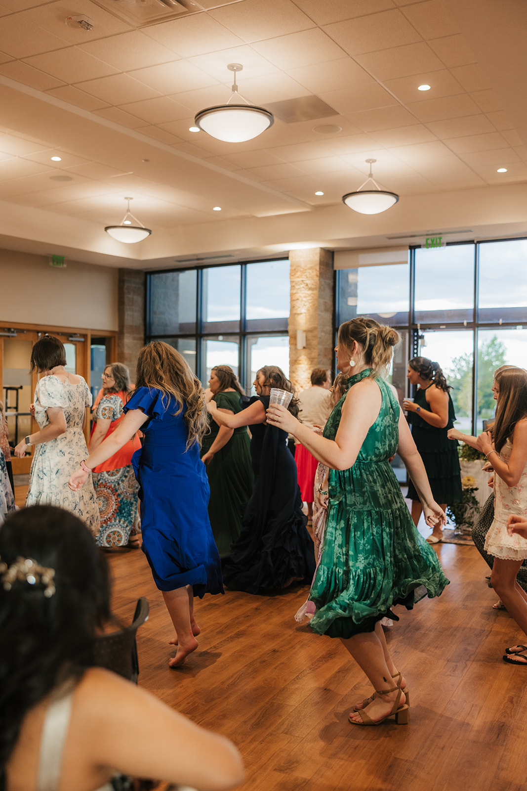 people dancing on the dance floor at a celebration