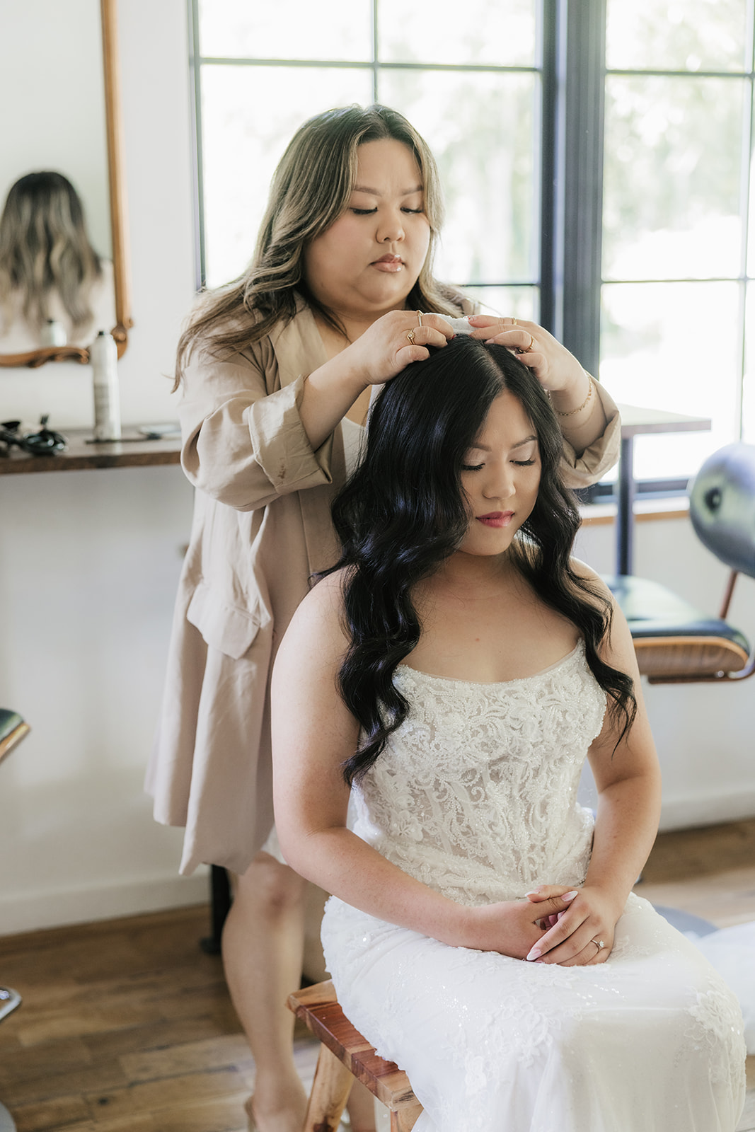 bride getting ready on her wedding day at spain ranch