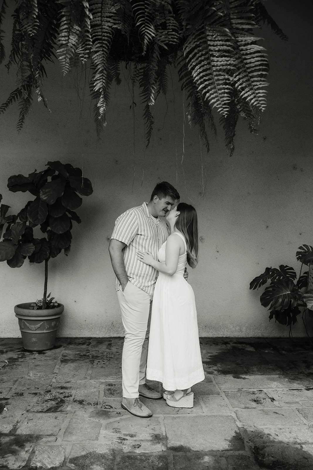 a couple has a romantic engagement session Philbrook Museum in Tulsa Oklahoma 