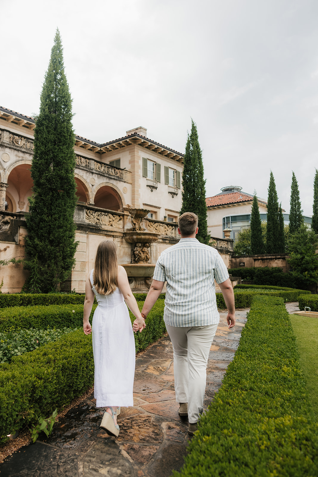 a couple has a romantic engagement session Philbrook Museum in Tulsa Oklahoma 