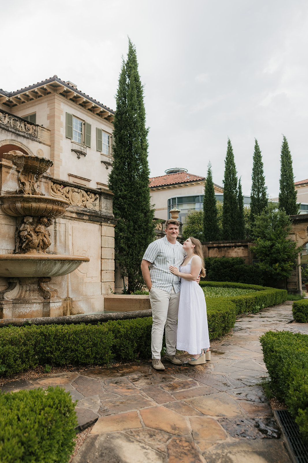 a couple has a romantic engagement session Philbrook Museum in Tulsa Oklahoma