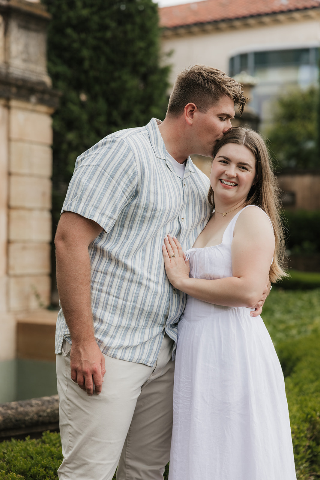 a couple has a romantic engagement session Philbrook Museum in Tulsa Oklahoma 
