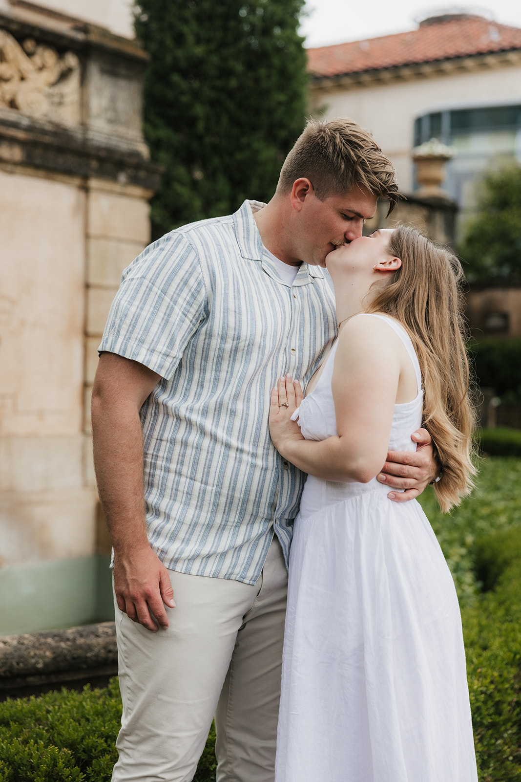 a couple has a romantic engagement session Philbrook Museum in Tulsa Oklahoma 