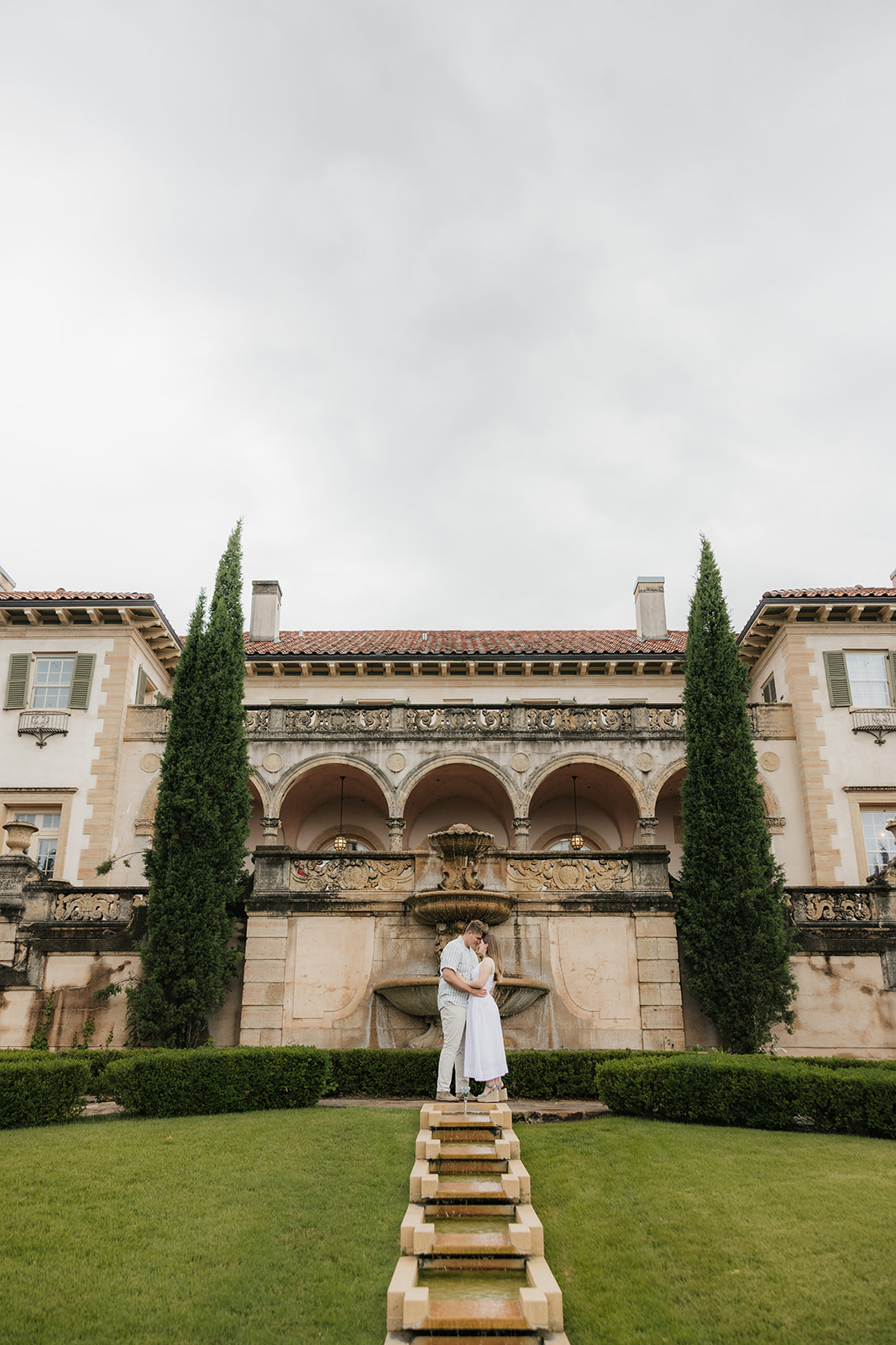 a couple has a romantic engagement session Philbrook Museum in Tulsa Oklahoma 