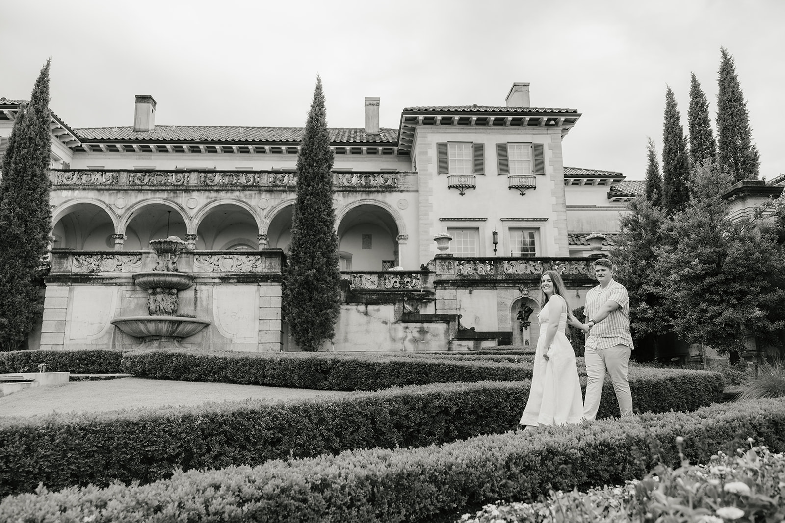a couple has a romantic engagement session Philbrook Museum in Tulsa Oklahoma 