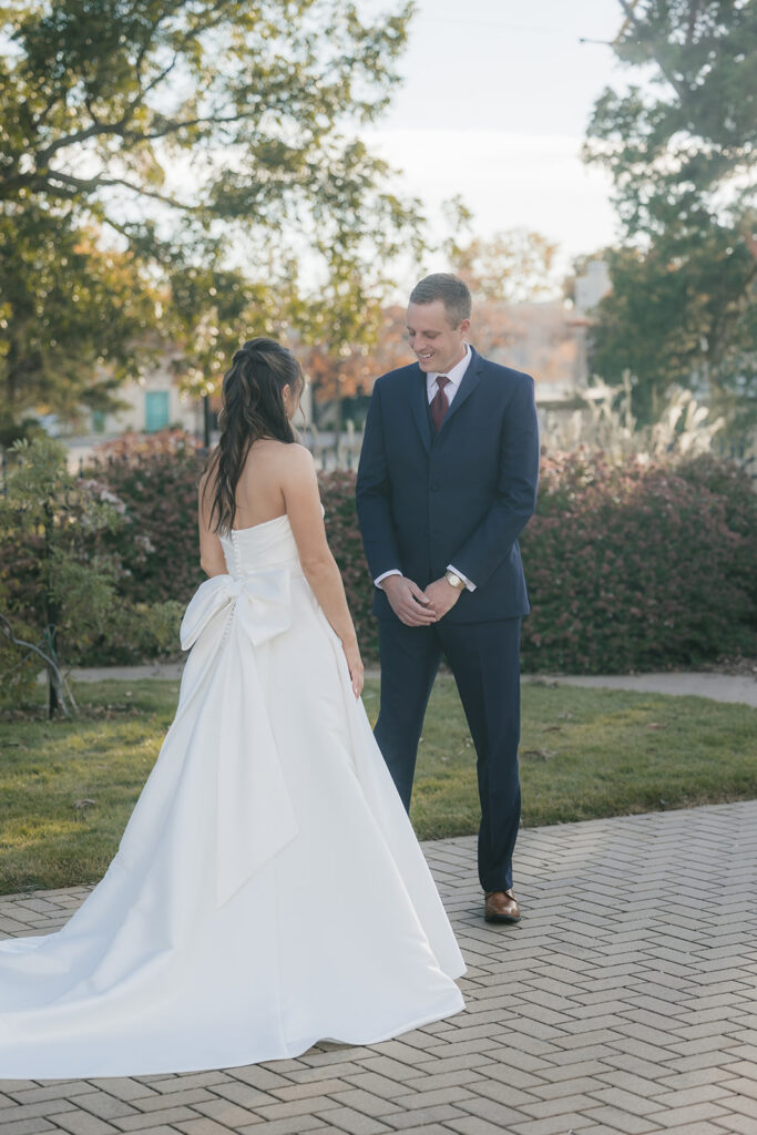 grom emotional seeing the bride in her wedding dress