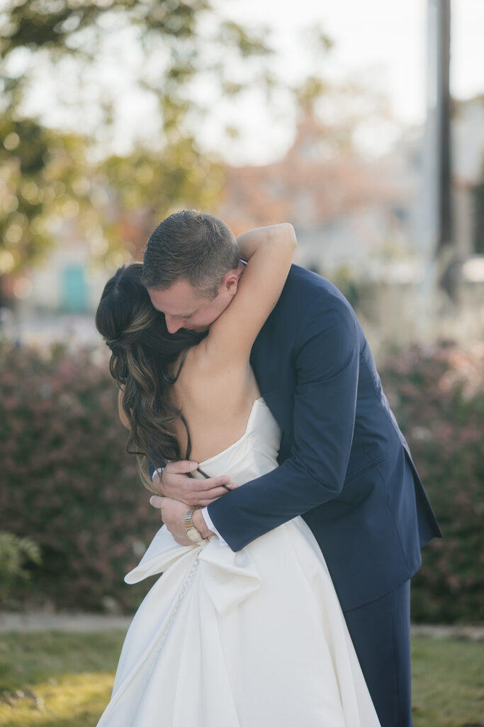 cute picture of the bride and groom hugging
