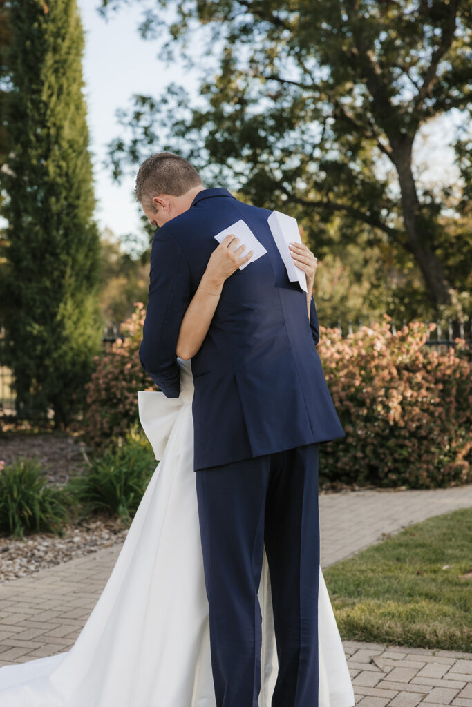 cute picture of the bride and groom hugging