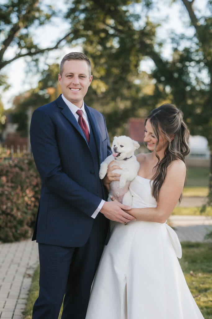 cute picture of the bride and groom with their dog