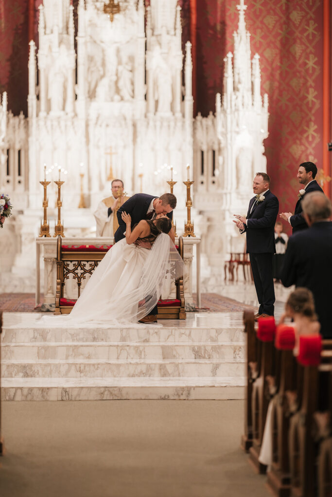 newlyweds kissing after their ceremony
