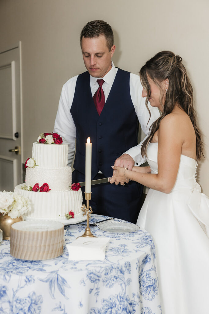 newlyweds cutting their wedding cake