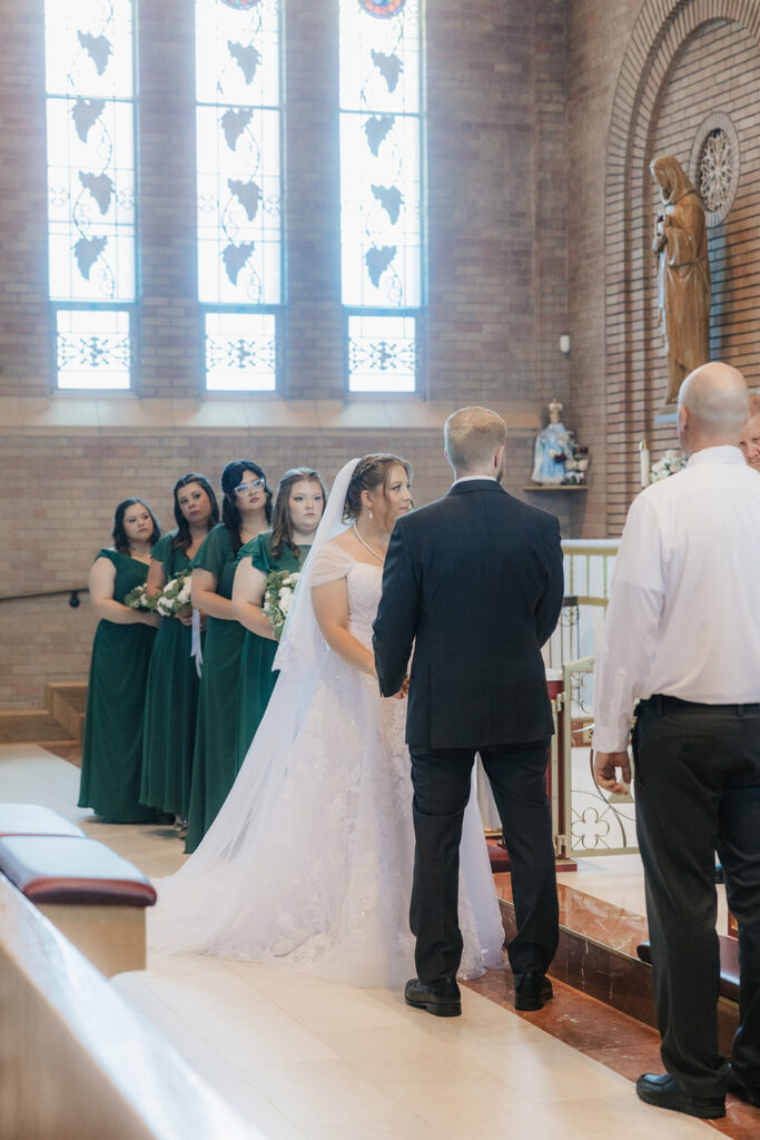 bride and groom holding hands during their ceremony