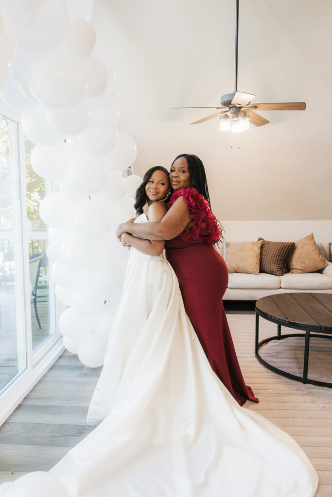 Cute picture of the bride and her mom hugging