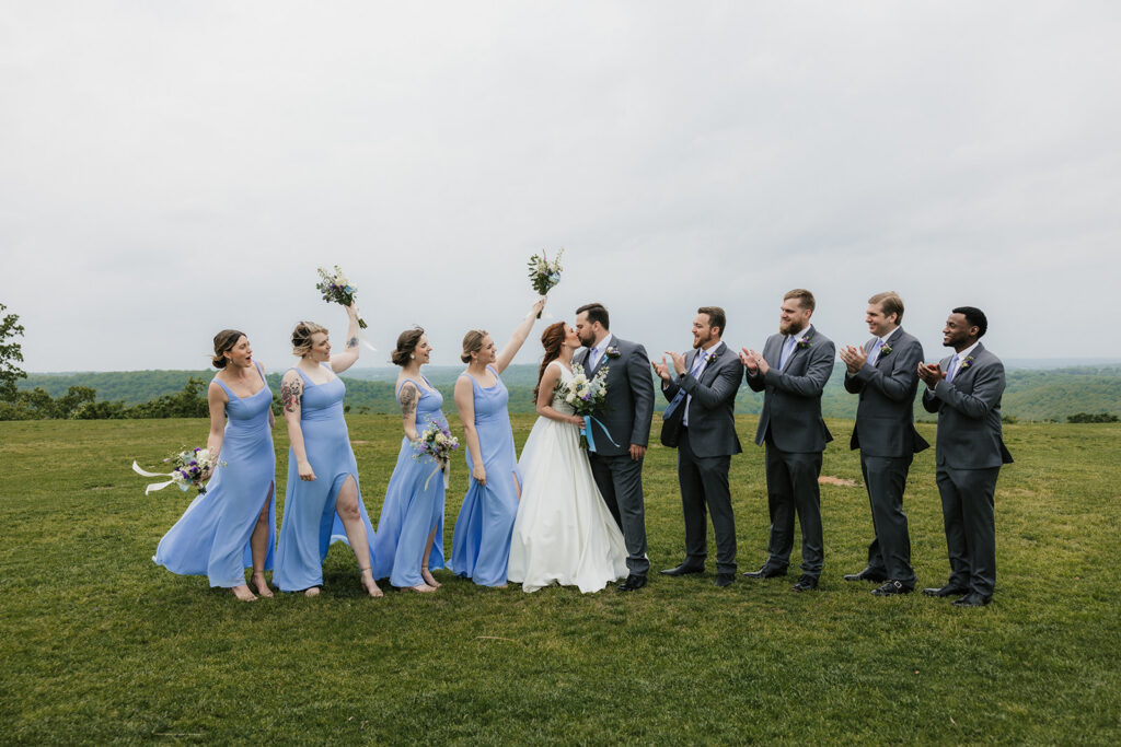 cute picture of the bride and groom with their bridal parties